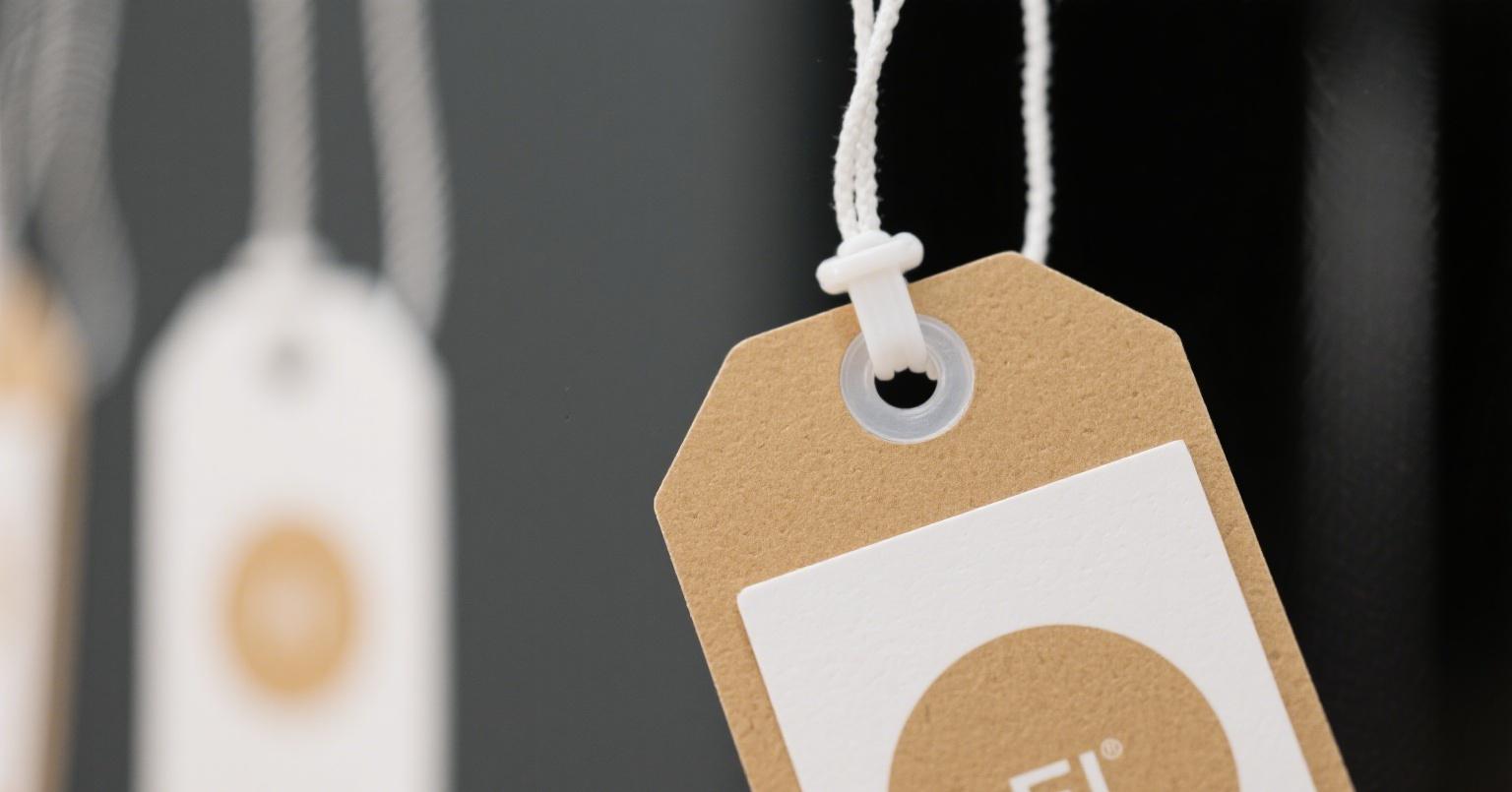 Secure attachment with plastic fastener hang tags for long-lasting durability
